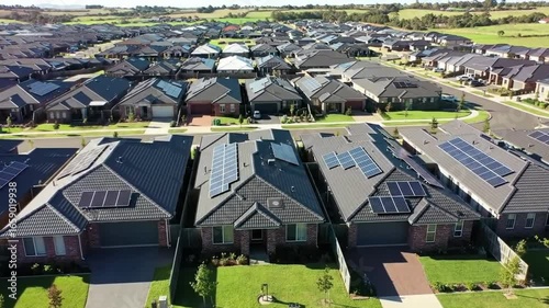 Aerial View of Suburban Houses with Solar Panels in a Residential Area