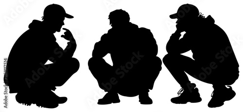 silhouette of three people crouching and talking casually