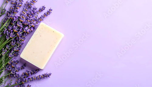 Natural Handmade Lavender Goat Milk Soap Bar with Fresh Lavender Sprigs on a Light Purple Background