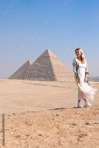 Female Traveler in the Desert in Front of Pyramids