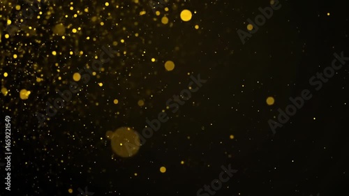 Golden particles scatter against a dark background, luminous and ethereal