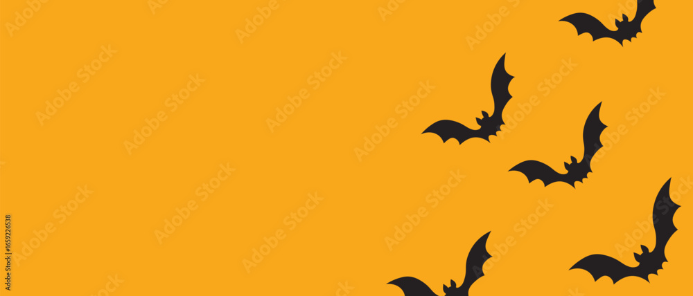Fototapeta premium Flying Bats on an Orange Halloween Background Banner