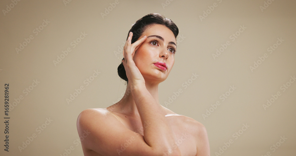 Obraz premium Woman, beauty and makeup with facial treatment for cosmetology on a studio background. Female person, model or thinking with cosmetics, dermatology or skincare for shine or skin glow on mockup space