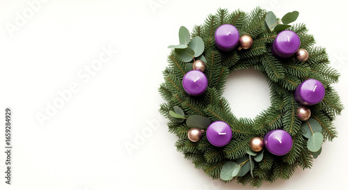 Elegant advent wreath with purple candles and evergreen branches for holiday decor
