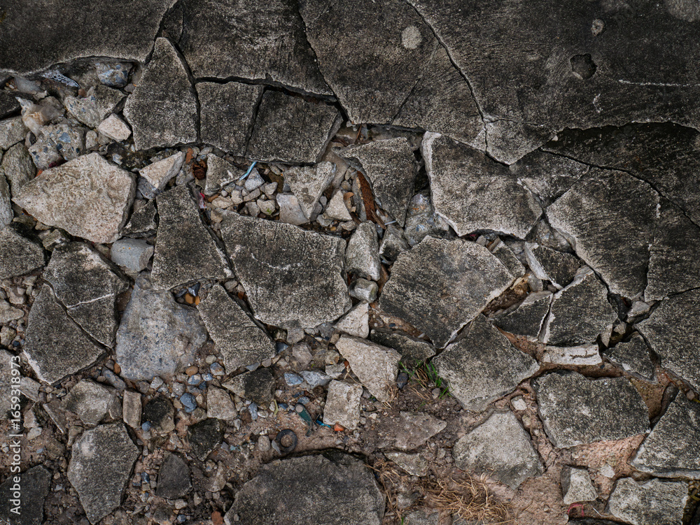 Fototapeta premium Cracked Concrete Floor with Chunky Fractures Texture Background.
