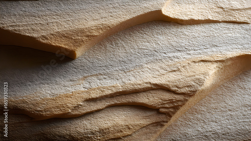 Rough stone surface revealing intricate natural texture, displaying organic patterns with earthy hues and subtle textural variations, perfect for graphic design backgrounds