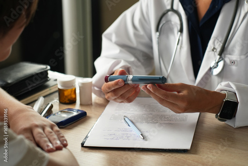 Doctor Explaining How to Use an Insulin Pen