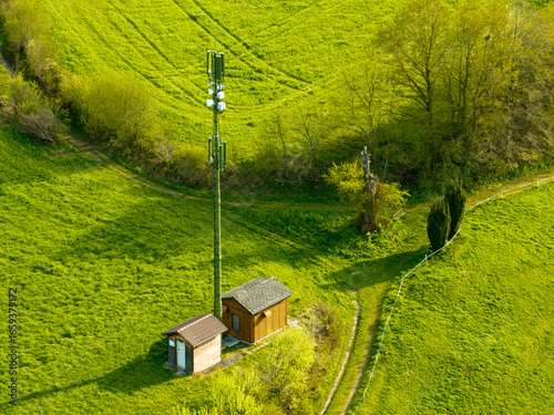 Aerial view of mobile phone antenna tower in rural area in Switzerland. Antenna in Sense district near Fribourg.