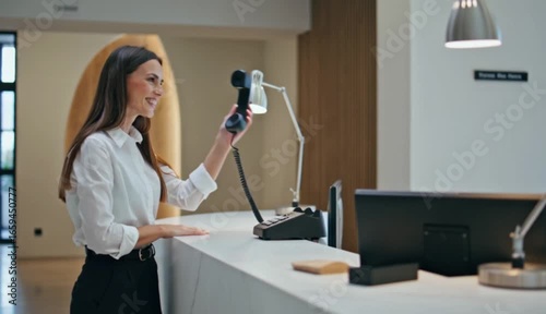Professional Reception Interaction Featuring Modern Technology and Business Setting