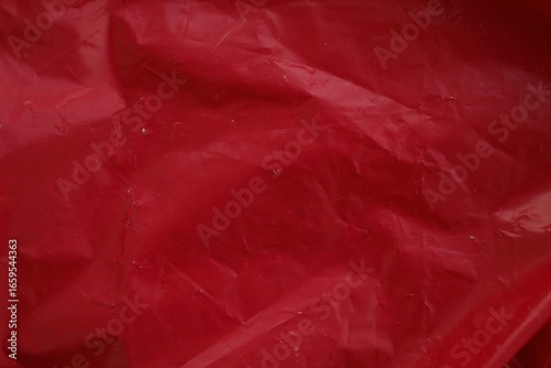 Texture of Red plastic bag smooth crumpled surface