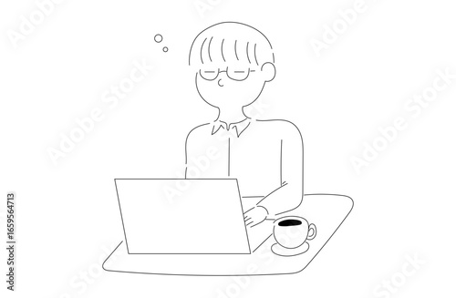 パソコン作業中のメガネの男性