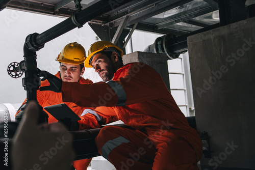 Konstfotografi Two professional engineer male teamwork service maintenance, Worker industry wat