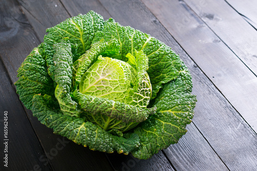 savoy cabbage from organic grower farm, on black wooden table