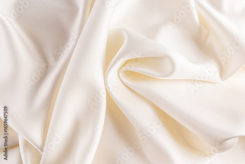 Luxurious satin fabric background with elegant folds