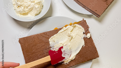 Obraz na płótnie A delicate dance of creamy decadence graces chocolate sheets, embodying festive