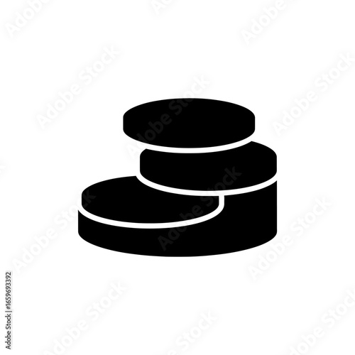 Balanced pile of black rubber hockey pucks isolated on white