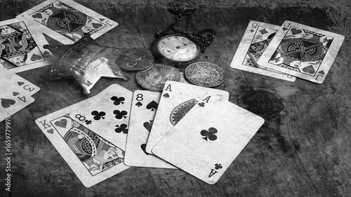 Simulated distressed old photo of the Dead man's hand . Aces and two Eights, named after Wild Bill Hickok who was killed 1876 while holding this poker hand. .Deadwood, Dakota Territory, USA