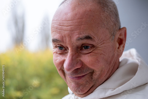 happy positive caucasian mature senior man 60-65 years old smiling on natural background, good mood, age-related changes, mental human health, enjoying nature, golden years