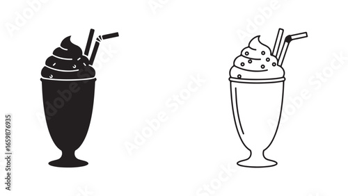 Milkshake in glass with straw and cream topping