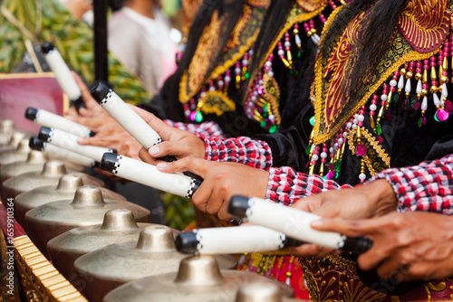 Musical instrument Reyong ( Reong) - brass gongs with mallets, part of Traditional Balinese orchestra Gamelan Kebyar. Arts, music, culture of Bali and Indonesian people. Asian travel background.