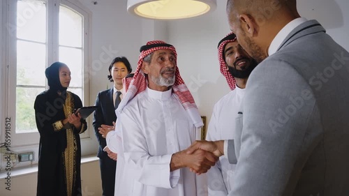 Business professional presenting monthly sales data on whiteboard, communicating strategic insights to arab investors during collaborative meeting in modern corporate environment