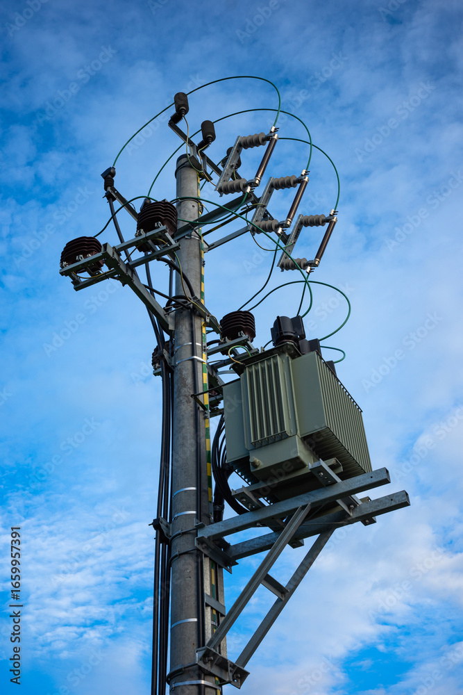 15kV power transformer on top of the electic pole. Local network of power supply. 15kV power transformer on top of the electic pole. Local network of power supply.