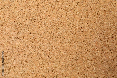 Cork background. Brown yellow color textured cork board background. Natural cork texture. Top view background. High resolution photo. Full depth of field.