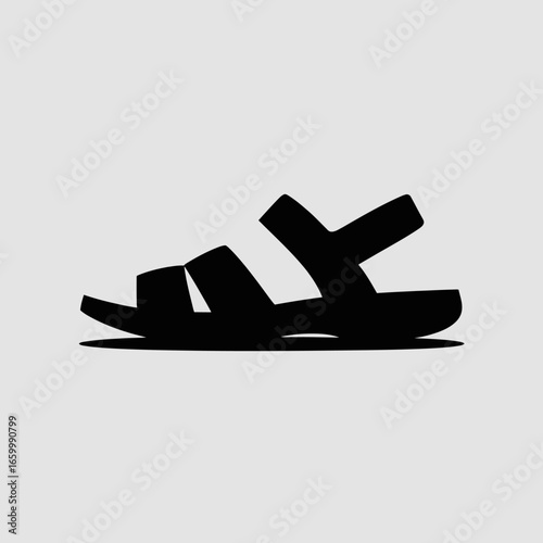 Stylized Black Sandal Silhouette on Light Background