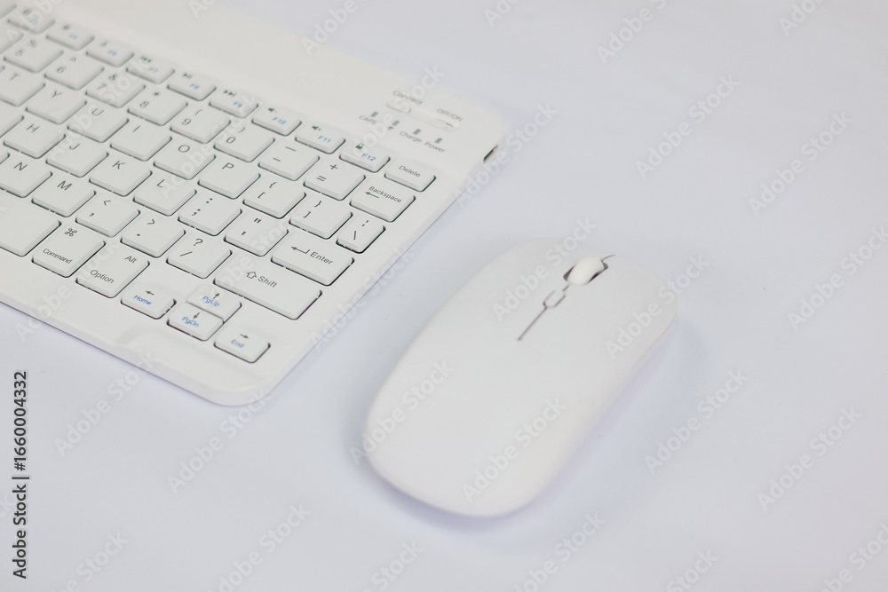 White computer keyboard and mouse on white background. Clipping Path. Selective focus. White computer keyboard and mouse on white background. Clipping Path. Selective focus.