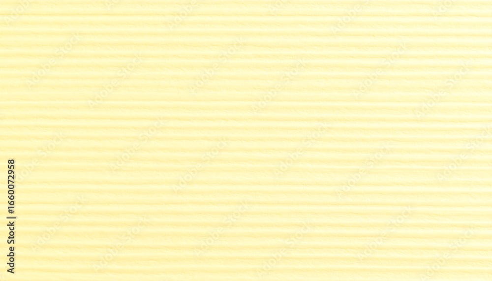 Fototapeta premium A soft, pale yellow surface exhibits regular, horizontal, ribbed lines.