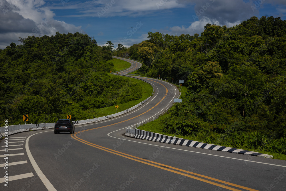 Fototapeta premium Sky Road, Curve No. 3, Nan Province, is on Highway No. 1081, traveling from Santisuk District to Bo Kluea District. It is a famous check-in point in Nan Province