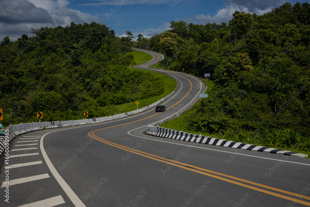 Fototapeta premium Sky Road, Curve No. 3, Nan Province, is on Highway No. 1081, traveling from Santisuk District to Bo Kluea District. It is a famous check-in point in Nan Province
