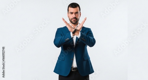 Businessman Showing Stop Gesture with Crossed Arms.