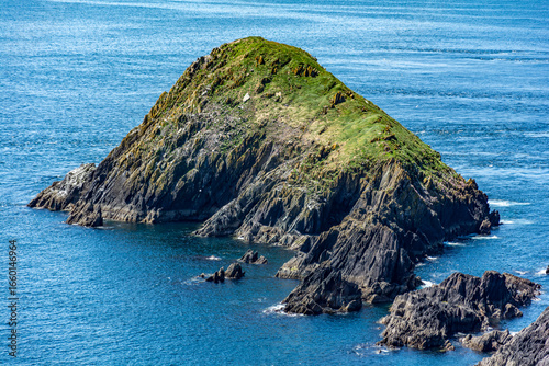 small rocky island at the west end of europe - dingle peninsula, ireland