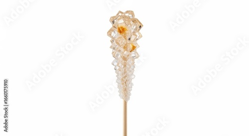 Crystalized sugar candy on a stick against white background