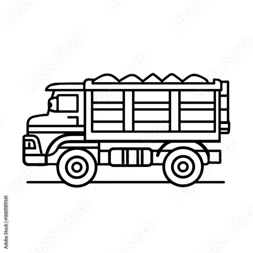 Heavy-duty truck with a flatbed design transporting materials in a construction setting with emphasis on utility and durability