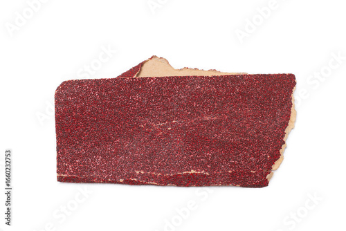 A piece of a used sheet of red sandpaper isolated on a white background