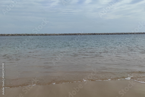 Seaside Breakwater Structure – Calm Ocean and Coastal Landscape