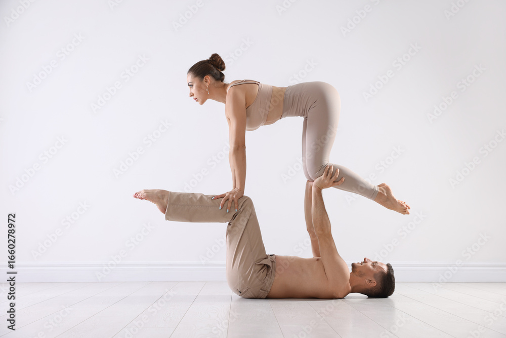 Naklejka premium Couple of professional dancers training in studio