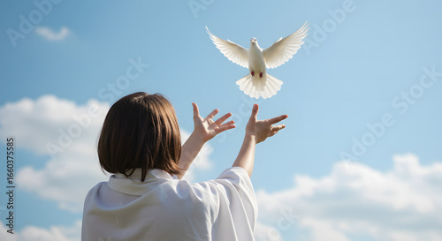 Woman Releasing White Dove into the Sky
