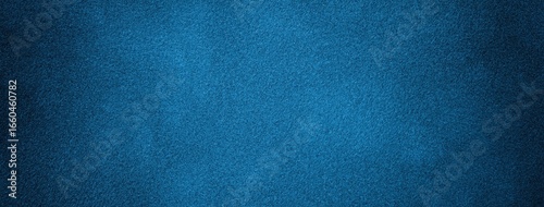 Dark blue background of suede fabric, macro. Velvet texture of navy textile. Felt soft denim backdrop with vignette