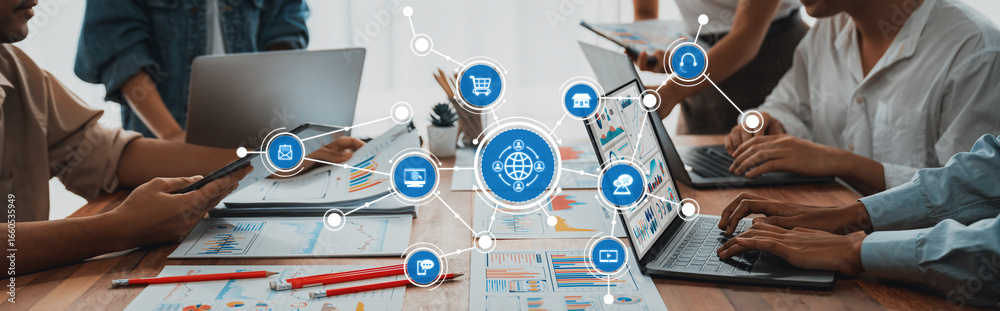 custom made wallpaper toronto digitalA modern workspace showcasing professionals collaborating on laptops, visualizing e-commerce strategies through a digital interface of icons, charts, and graphs. Amity