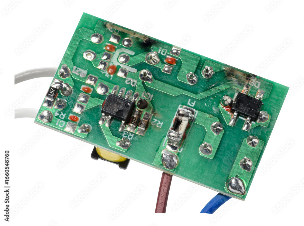 Green electronic board with various components and several wires connected, isolated on background Green electronic board with various components and several wires connected, isolated on background
