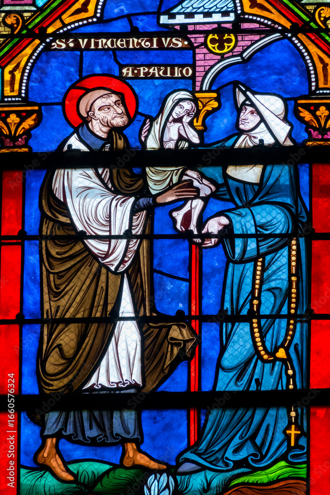 Fototapeta premium St. Vincent de Paul carrying a child