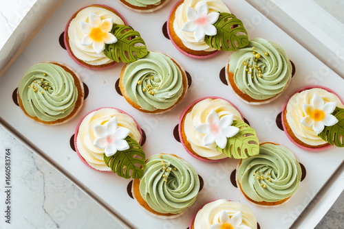Assortment of pistachio flavor Cupcakes in a gift box on white background