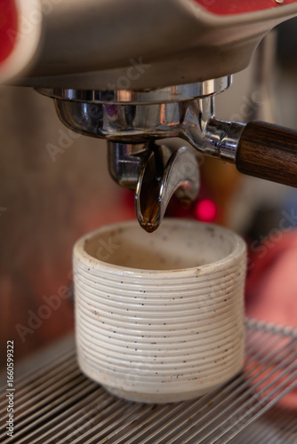 Closeup of a Ceramic Cup Under a Coffee Machine