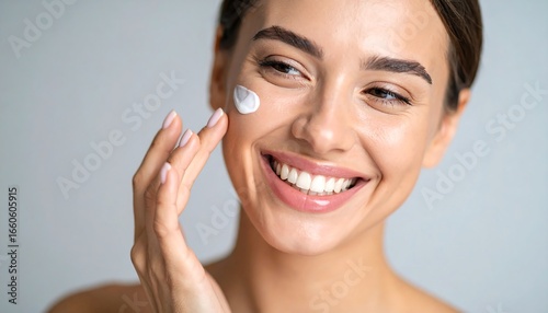 Woman applying facial cream (4)