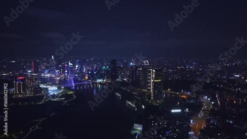 Wallpaper Mural Aerial night view Ho chi minh city and Saigon river in Vietnam, illuminated of bridge and business center with skyscrapers. Torontodigital.ca