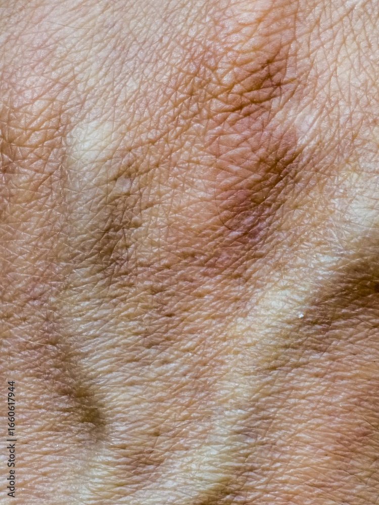 Fototapeta premium Close up of wrinkled human skin texture with natural lines and details