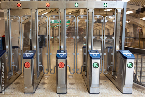 Modern Fare Gates New fare gates installed in a Bay Area public transit station. The design reflects updates in security, accessibility, and commuter experience within the urban transportation system.